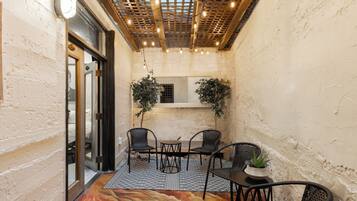 Deluxe Suite, Multiple Beds, Patio, Ground Floor | Terrace/patio