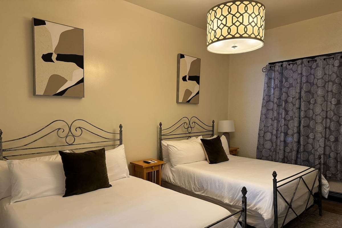Deluxe Room, 2 Queen Beds | Premium bedding, down comforters, individually decorated