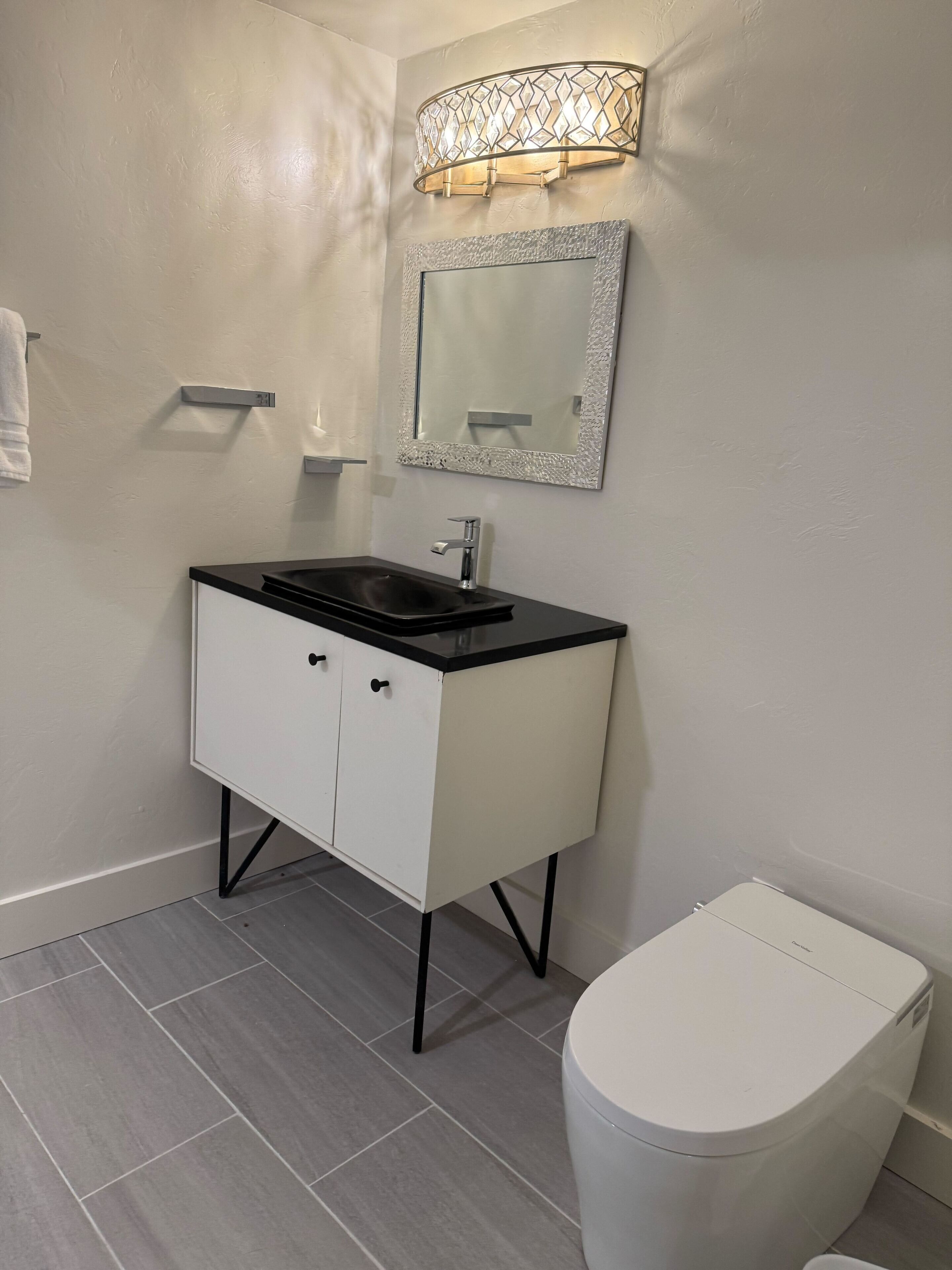 deluxe suite, multiple beds, patio, ground floor | bathroom | combined shower/bathtub, free toiletries, hair dryer, bathrobes