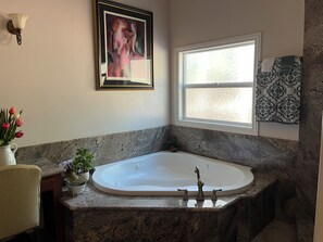 Bathtub, jetted tub, towels, soap
