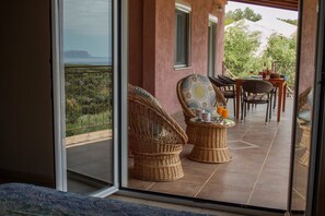 Relax on the balcony with a refreshing drink, taking in the breathtaking mountain views.