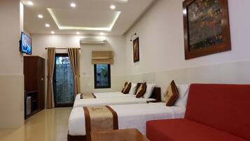 Deluxe Family Room, Balcony | Minibar, desk, free WiFi, bed sheets