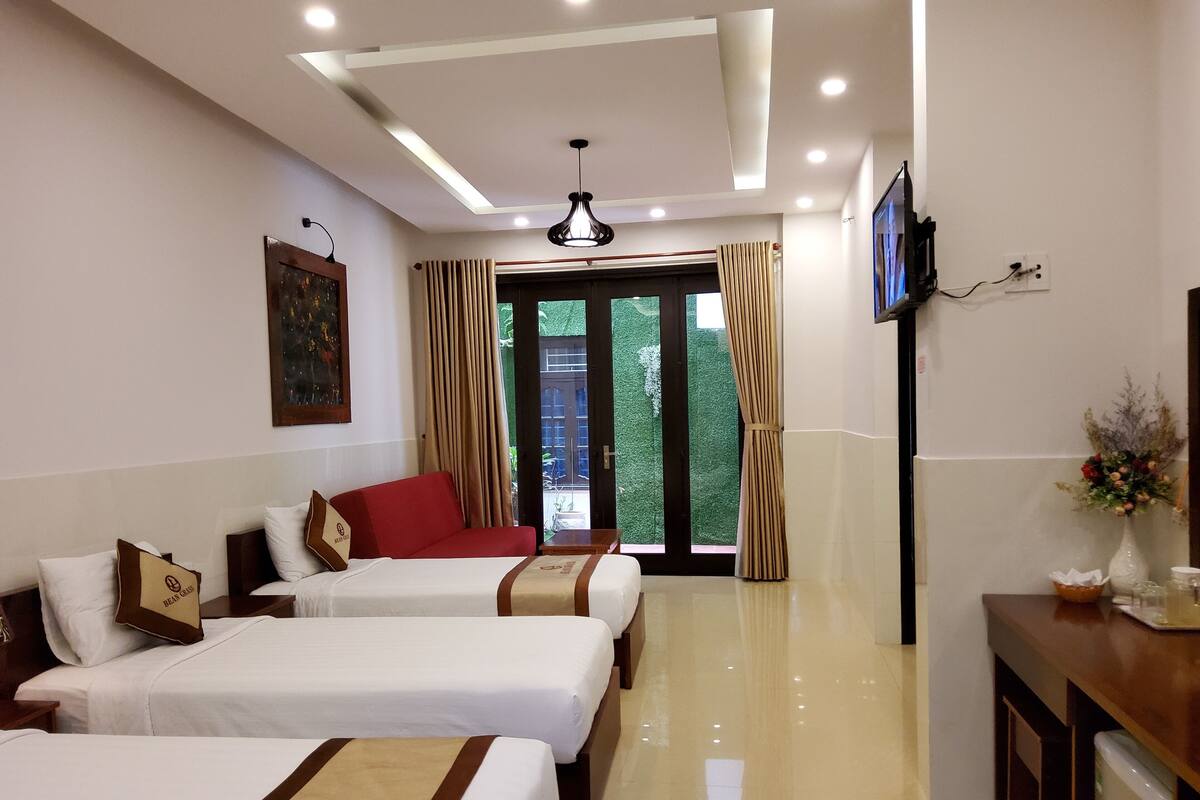 Deluxe Family Room, Balcony | Minibar, desk, WiFi (free), bed sheets