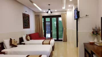 Deluxe Family Room, Balcony | Minibar, desk, free WiFi, bed sheets