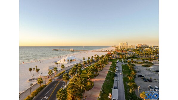 Walk along the beach and enjoy the scenic promenade lined with palm trees.