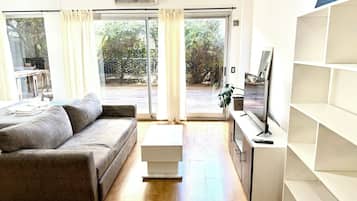 Exclusive Apartment | Living area | Flat-screen TV