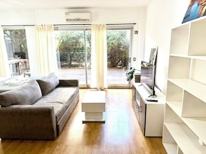 Apartamento exclusivo | Área de estar | TV de tela plana