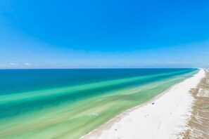 On the beach, sun-loungers, beach towels