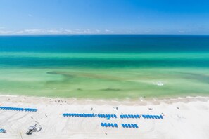 On the beach, sun loungers, beach towels