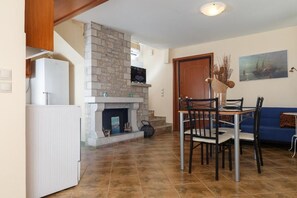 Family Villa, 3 Bedrooms, Pool Access, Sea View | Living area | LCD TV, fireplace, DVD player