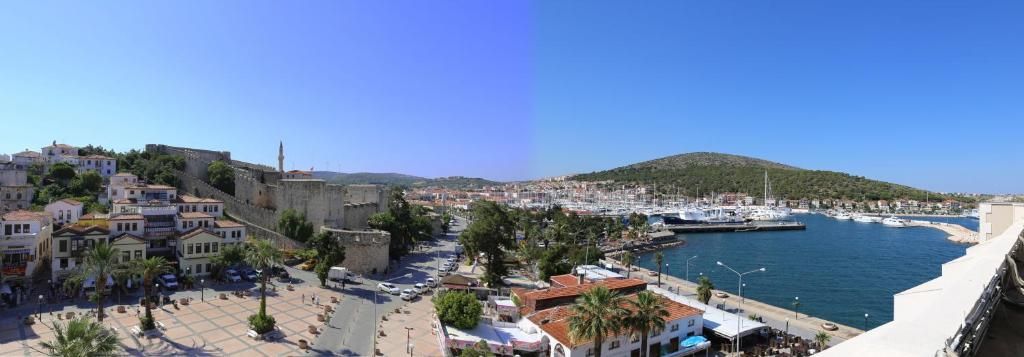 A coastal town with a historic fort, a marina, and a promenade.