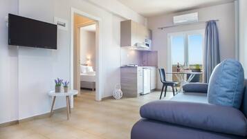 Departamento, 1 habitación | Área de sala de estar | Televisión de pantalla plana