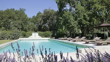 Seasonal outdoor pool, open 8:30 AM to 10:30 PM, pool umbrellas
