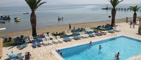 On the beach, sun loungers, beach umbrellas, beach bar