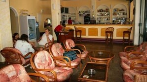 A bar area with a counter and seating. - Lemon Grove Hotel and Studios (Corfu)