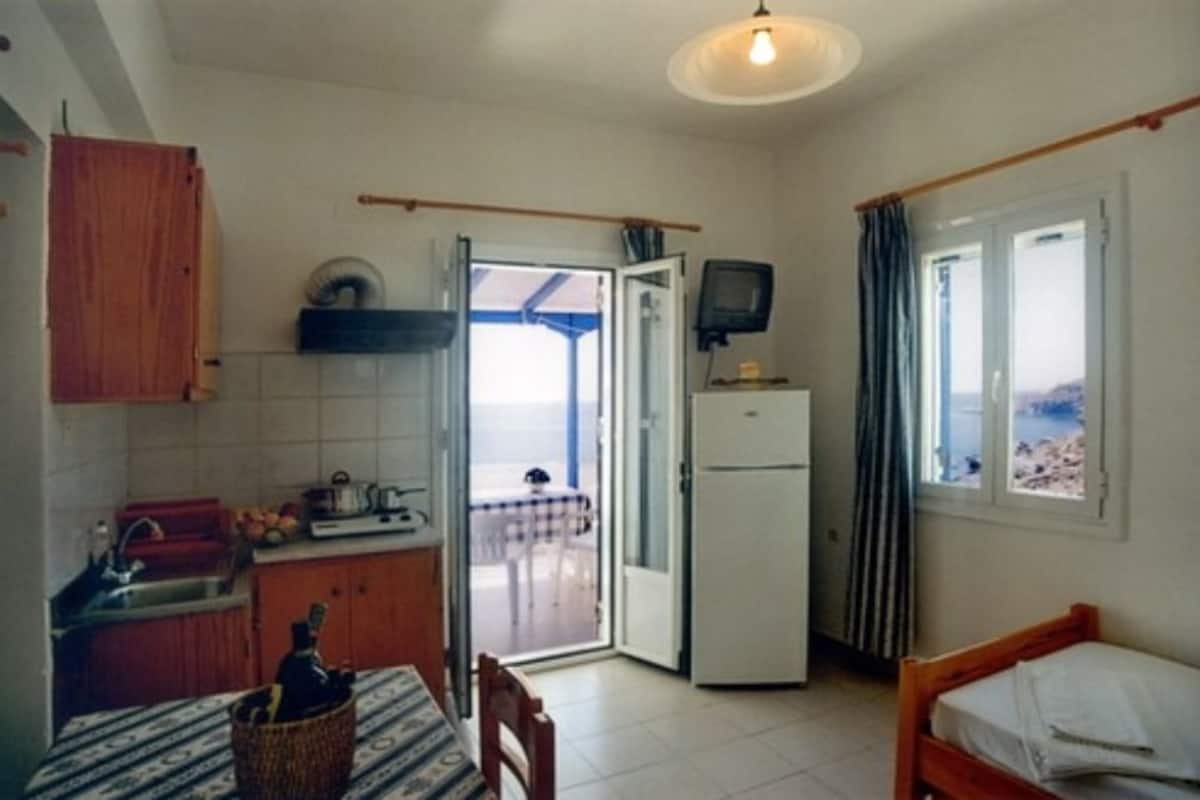 Apartment, 1 Bedroom, Sea View | Living area | TV