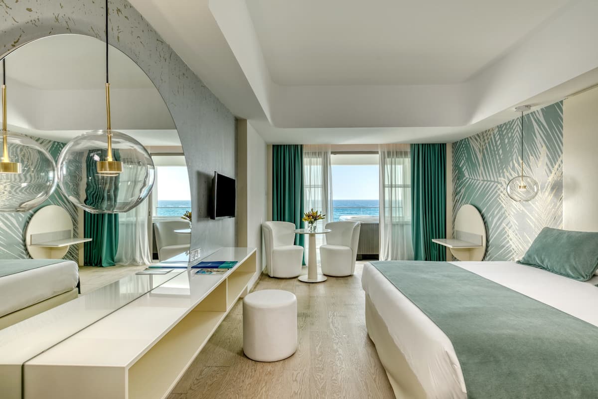 junior suite, jetted tub, sea view | 1 bedroom, premium bedding, minibar, in-room safe