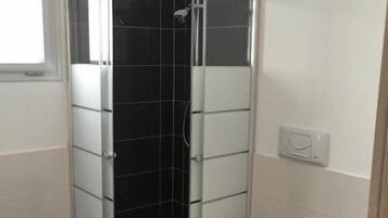 Shower, rainfall showerhead, bidet, towels