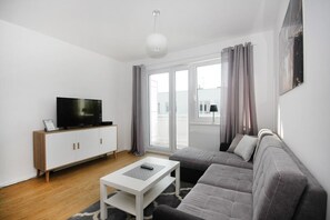 Appartement, 1 chambre | Aire de séjour | Téléviseur à écran plat
