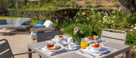 Breakfast, lunch served; Italian cuisine, garden views