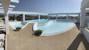 Outdoor pool, open 10:00 AM to 6:30 PM, pool umbrellas, sun loungers
