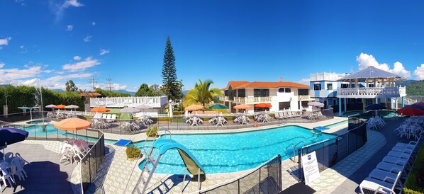 Outdoor pool, free pool cabanas, pool umbrellas