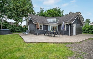 Enjoy dining al fresco on the spacious deck with a dining area, perfect for hosting gatherings.