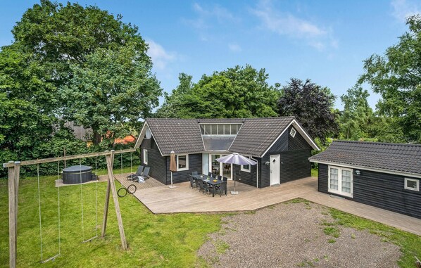 Enjoy al fresco dining on the spacious outdoor deck with a dining area, perfect for hosting gatherings.