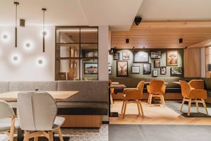 A modern interior with a seating area, wooden accents, and wall-mounted artwork. - Hotel Ziach & Candy (Grossarl)
