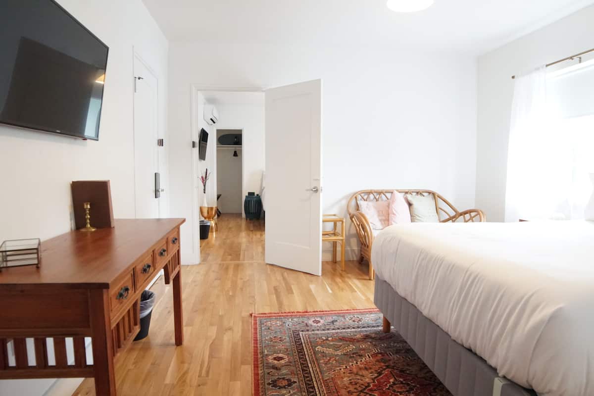 1 bedroom, premium bedding, down comforters, blackout drapes