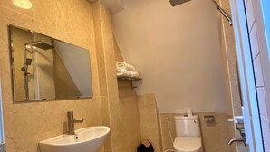 A bathroom with a sink, mirror, shower, and toilet. - HANZ Thien Nien Ky Hotel Da Lat (Cam Ly - Da Lat)