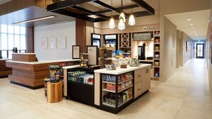 A modern retail space with a reception area, display counters, and a variety of products. - Hilton Garden Inn Elizabethtown, KY (Elizabethtown)