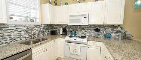 Condo, 2 Bedrooms | Private kitchen | Fridge, microwave, oven, dishwasher