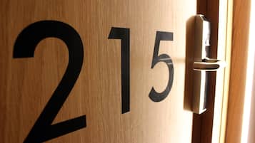A wooden door with the number 215.