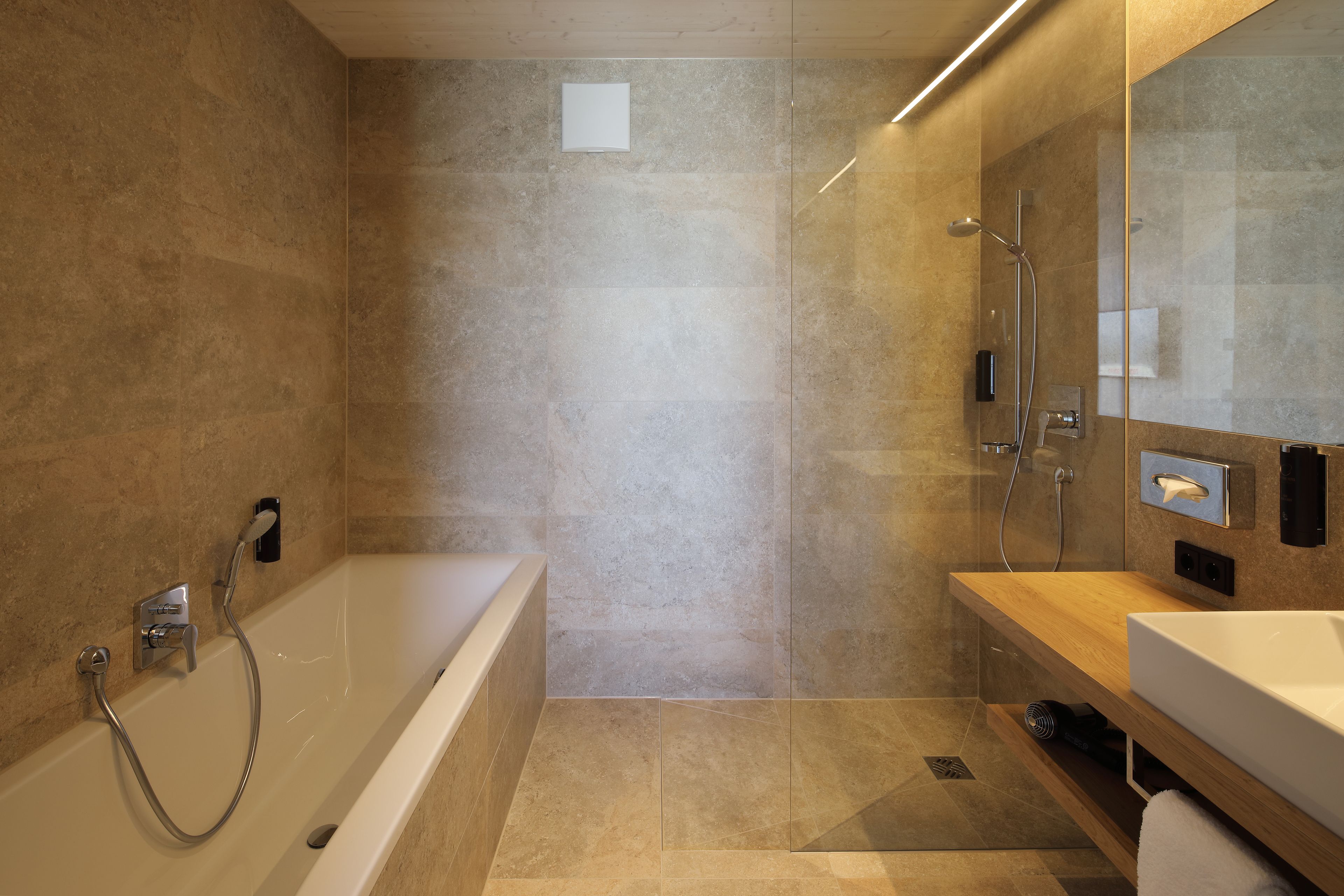 junior suite | bathroom | shower, free toiletries, hair dryer, towels