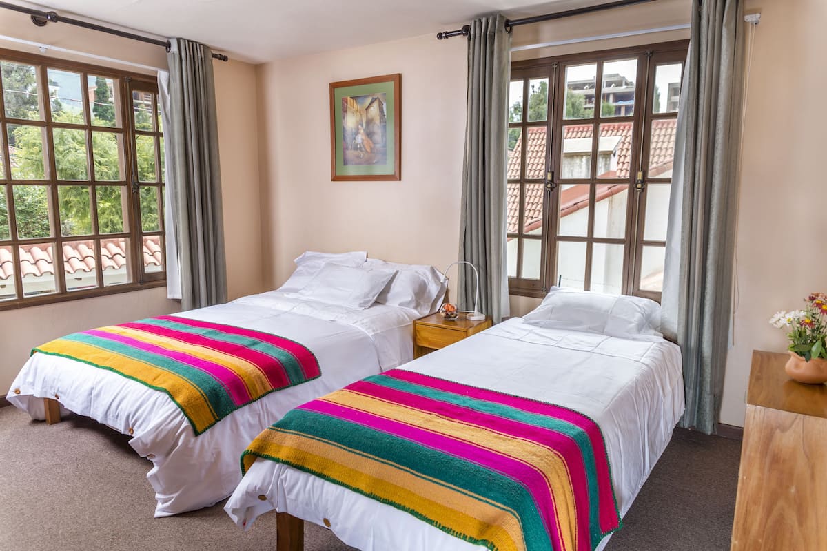 Triple Room, Garden View | In-room safe, blackout drapes, free WiFi, bed sheets
