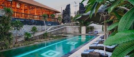 Outdoor pool, pool umbrellas, sun loungers