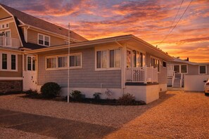 A single-story house with a front porch, a garage, and a driveway. - Lavallette BEACH BLOCK, Wifi, C- AC, sleeps 9, 2 Baths, 9 Houses to Beach! (Lavallette)