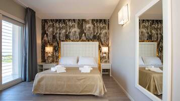 Standard Double Room, Sea View | Minibar, in-room safe, individually decorated, desk