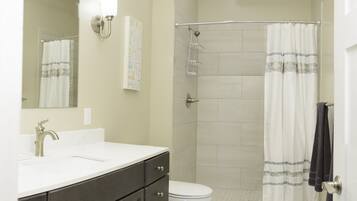Combined shower/tub, hair dryer, towels, soap
