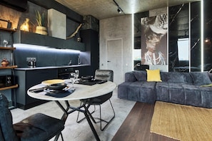 Luxury Studio Suite, 1 King Bed | Living area | Flat-screen TV, heated floors