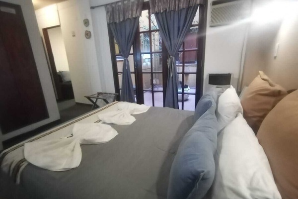 Standard Quadruple Room | Down comforters, in-room safe, desk, laptop workspace