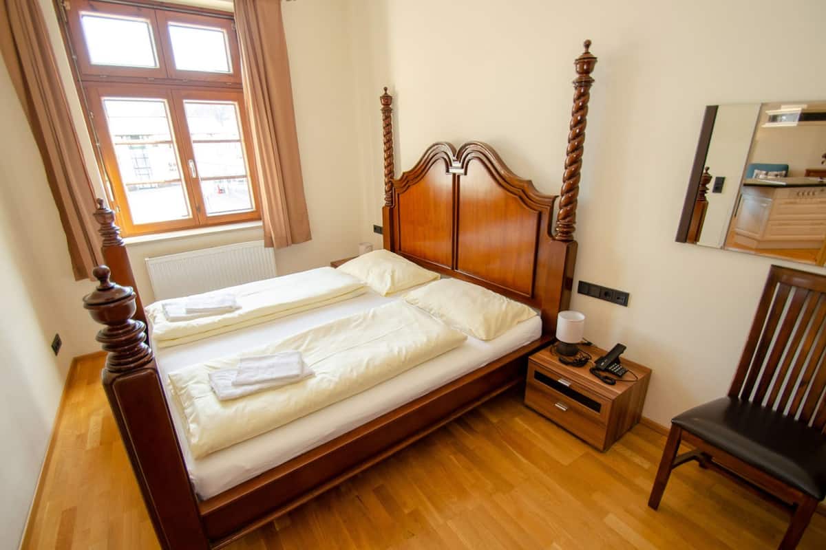 Aparthotel Post 3C | Een kluis op de kamer, gratis wifi, beddengoed
