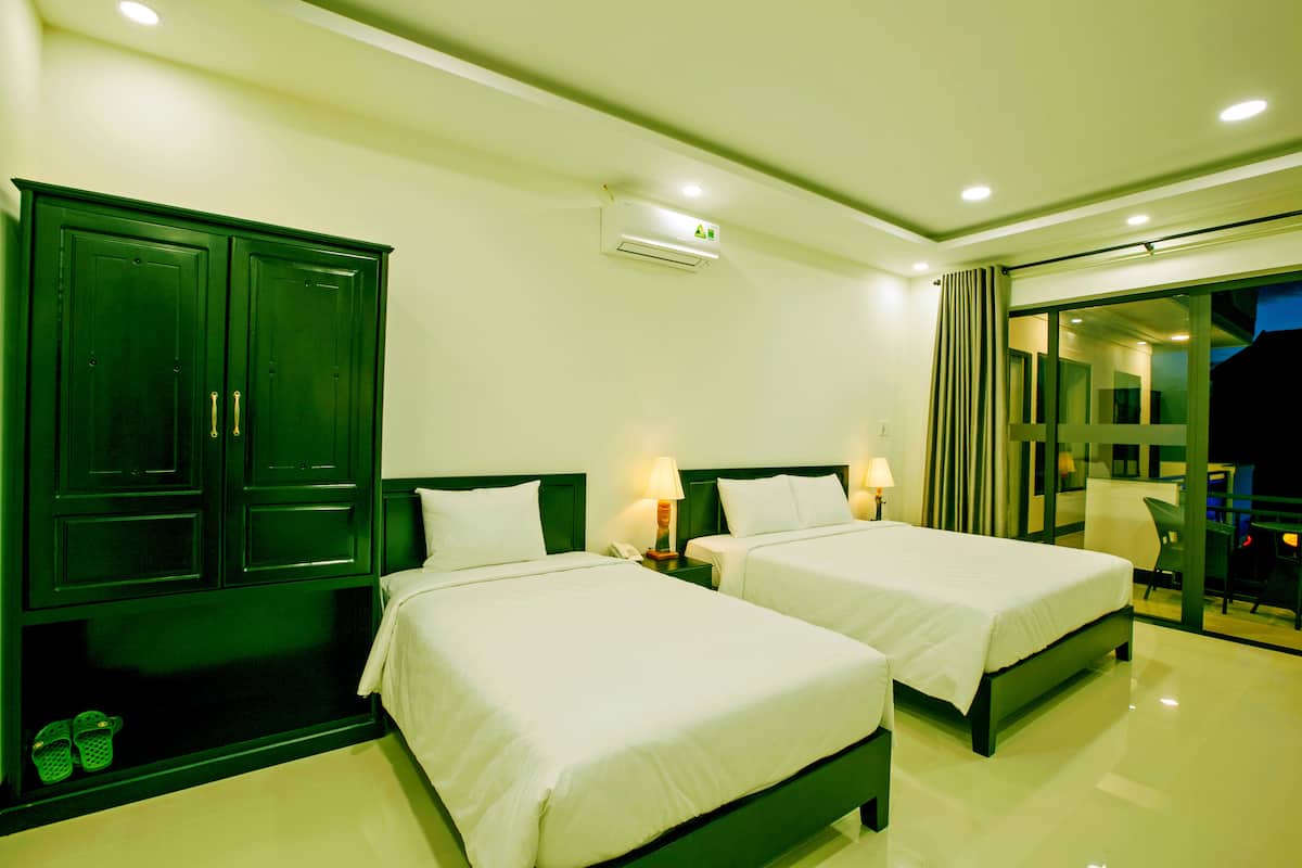 Deluxe Triple Room, Garden View | Premium bedding, minibar, in-room safe, desk