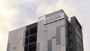 A modern building with a sign reading 'RAMADA encore.' - Ramada Encore Makati (Makati City)