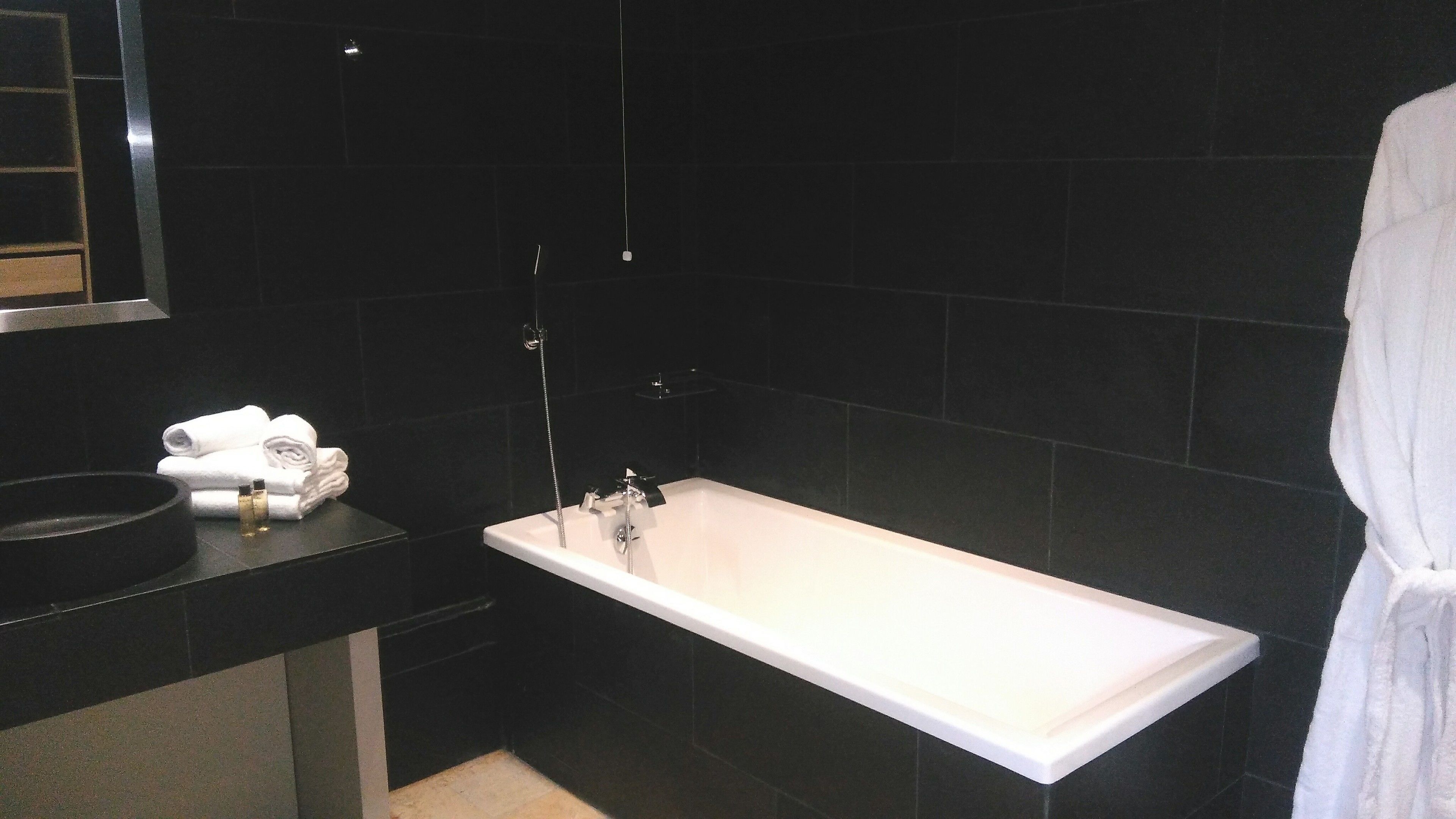 junior suite | bathroom | separate bathtub and shower, rainfall showerhead, free toiletries