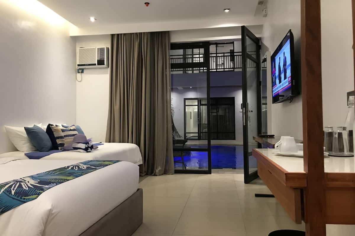 superior room | in-room safe, desk, iron/ironing board, rollaway beds