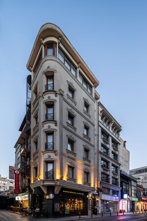 A multi-story hotel with a classic architectural design, featuring balconies and a ground-level restaurant. - Felicity Hotel Istanbul  (Istanbul)