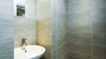 Shower, slippers, bidet, towels