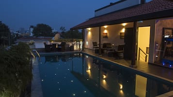 Indoor pool, a rooftop pool, pool loungers